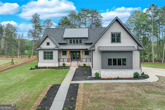 view of front of home featuring a front lawn and covered porch