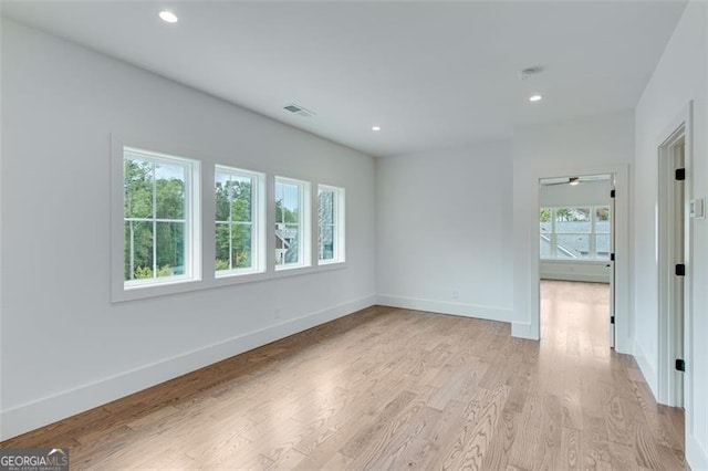 spare room featuring light hardwood / wood-style floors