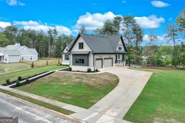 view of front of home with a garage and a front yard