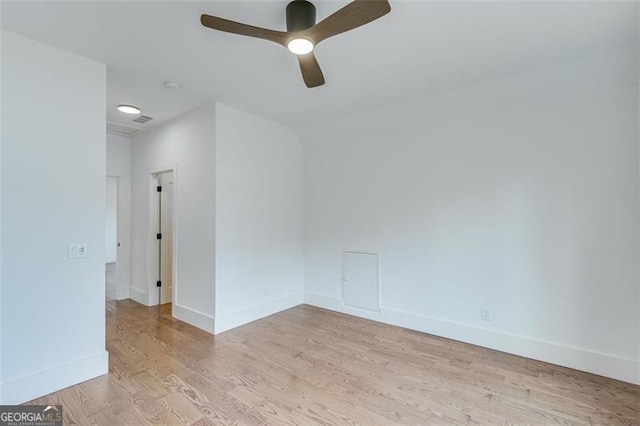 unfurnished room with ceiling fan and light hardwood / wood-style flooring