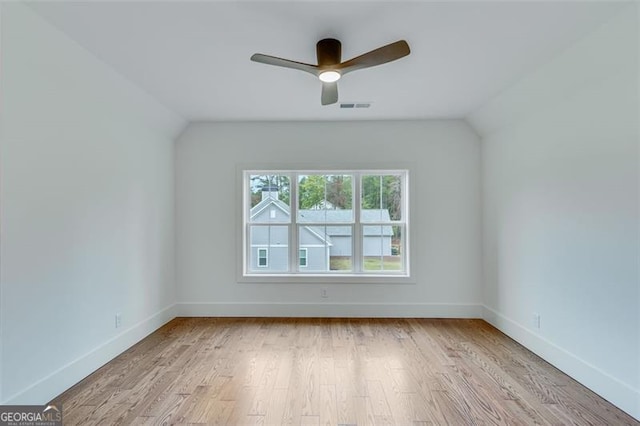 additional living space with ceiling fan, vaulted ceiling, and light hardwood / wood-style floors