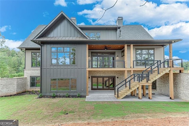 rear view of house with a patio, a balcony, ceiling fan, and a yard