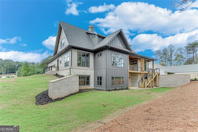 rear view of house with a yard