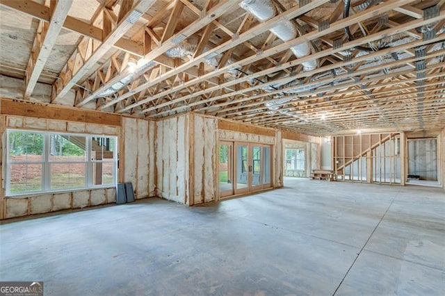 miscellaneous room featuring concrete flooring and a wealth of natural light