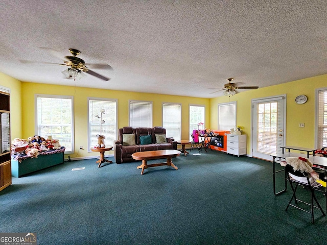 living room with a wealth of natural light and ceiling fan