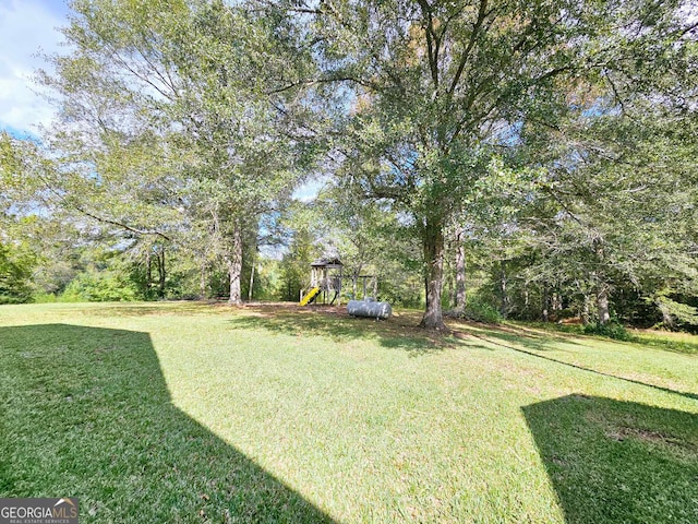 view of yard with a playground