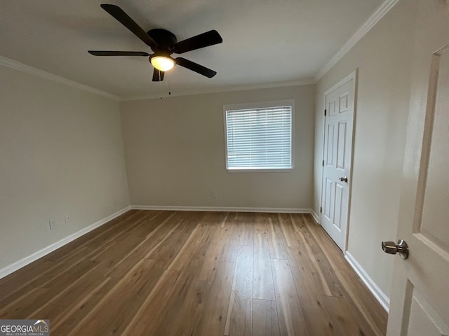 unfurnished room with ornamental molding, ceiling fan, and hardwood / wood-style flooring