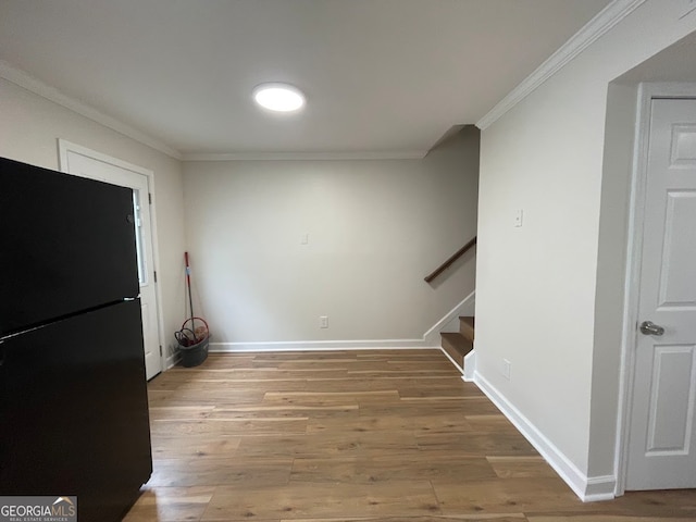 interior space featuring ornamental molding and hardwood / wood-style flooring