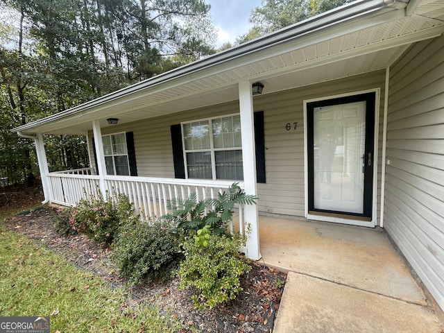 doorway to property with a porch