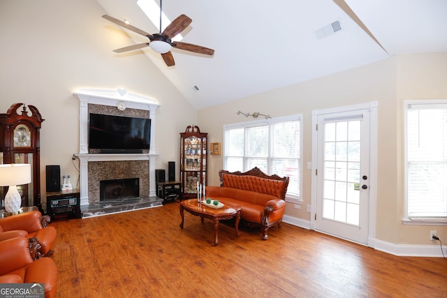 living room with high vaulted ceiling, wood-type flooring, and ceiling fan