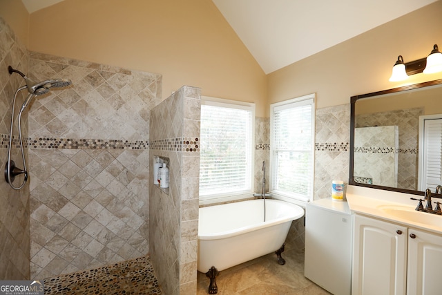 bathroom with independent shower and bath, vanity, and lofted ceiling