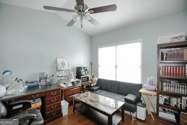 office space featuring ceiling fan, lofted ceiling, and dark wood-type flooring