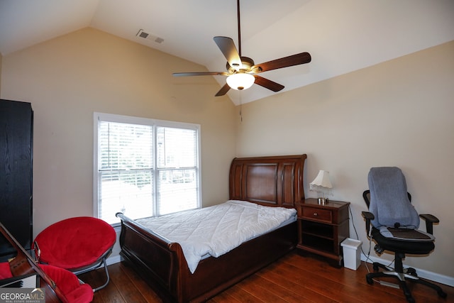 bedroom featuring lofted ceiling, dark hardwood / wood-style flooring, and ceiling fan