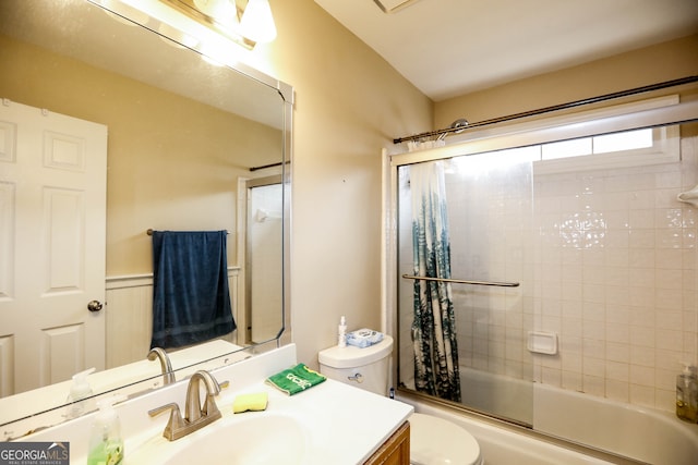 full bathroom with shower / bath combination with glass door, vanity, and toilet