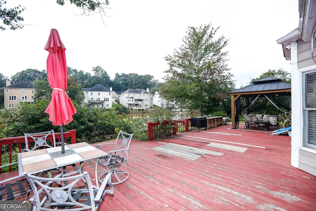 wooden deck featuring a gazebo