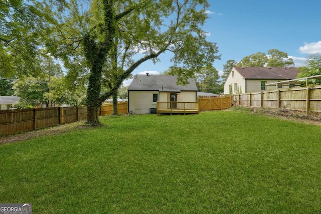 view of yard with a wooden deck