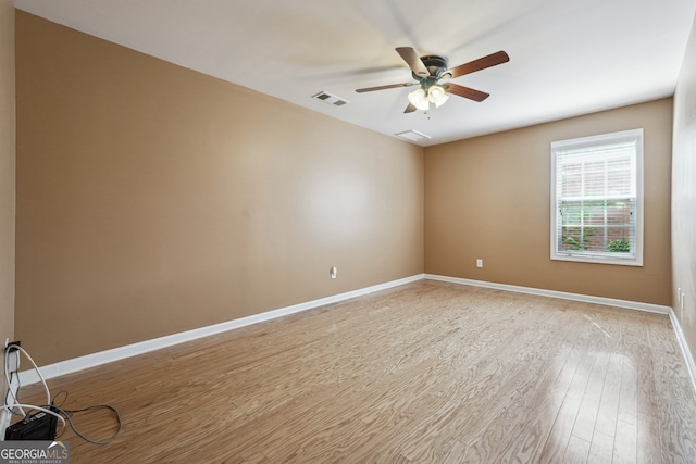 unfurnished room with ceiling fan and light hardwood / wood-style flooring