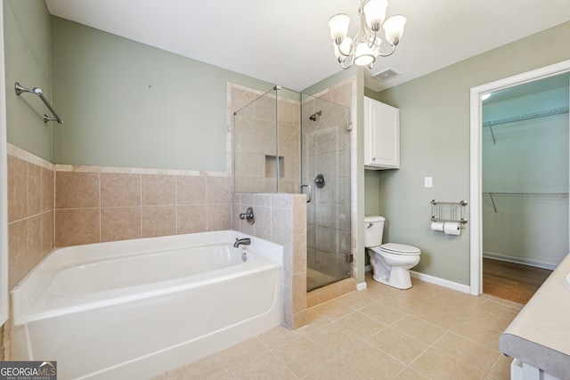 full bathroom with independent shower and bath, an inviting chandelier, tile patterned floors, vanity, and toilet