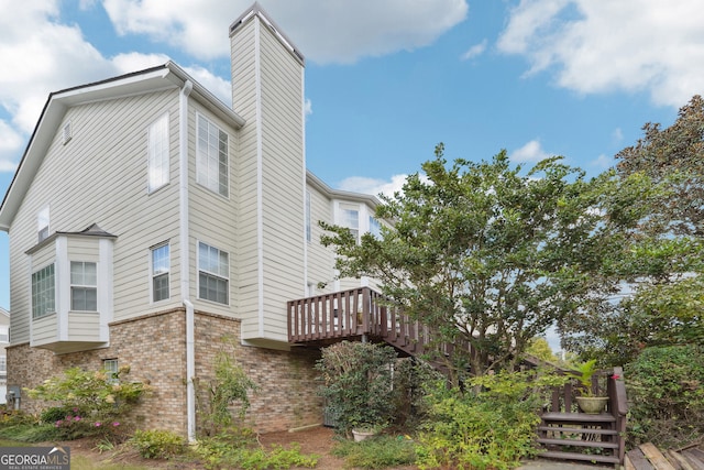 view of side of property with a wooden deck