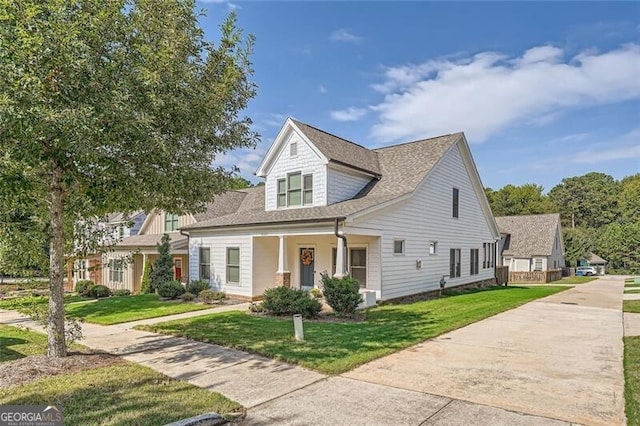 view of front of home with a front lawn and a porch