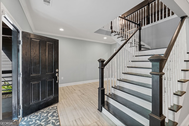 entrance foyer with ornamental molding