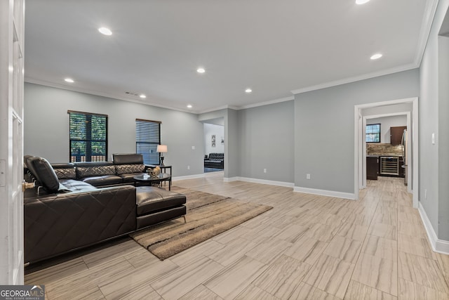 living area with recessed lighting, visible vents, baseboards, and ornamental molding