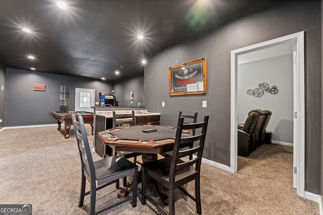 dining room with light carpet and indoor bar