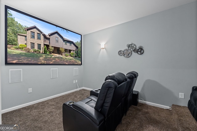 home theater room with carpet flooring and baseboards