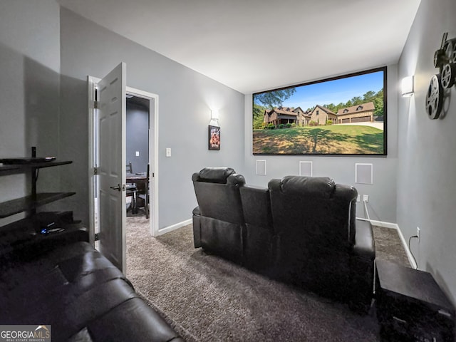 carpeted home theater room featuring baseboards