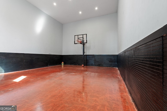 view of sport court featuring basketball hoop
