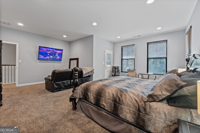 carpeted bedroom with visible vents, baseboards, and recessed lighting
