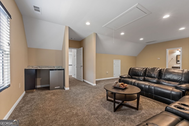 carpeted living room with vaulted ceiling