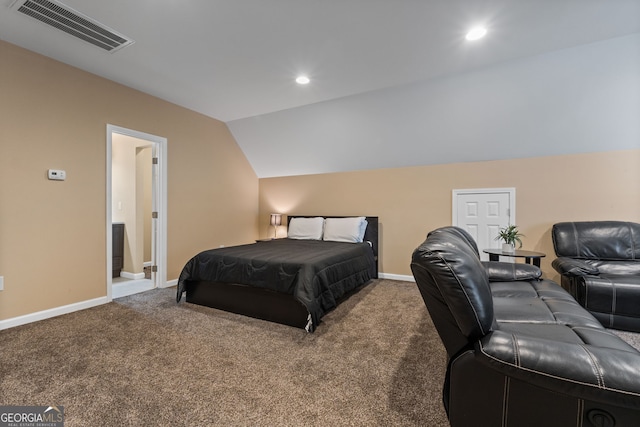 bedroom with lofted ceiling and carpet flooring