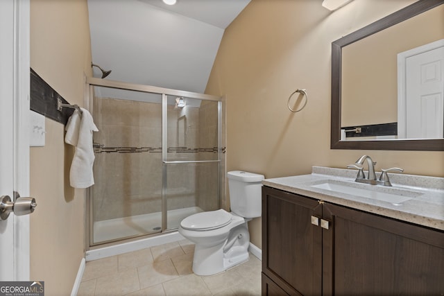 bathroom with vanity, a stall shower, tile patterned flooring, toilet, and lofted ceiling