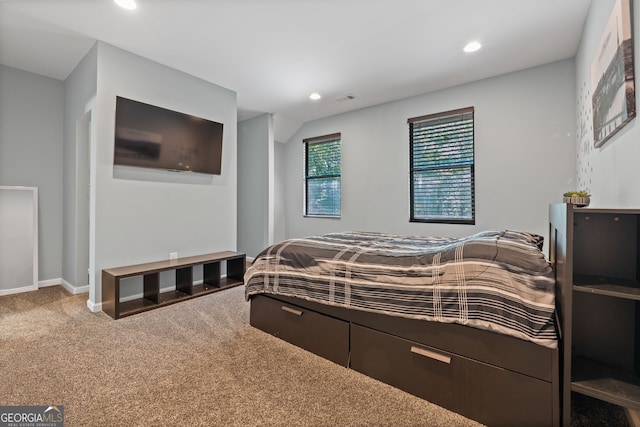 carpeted bedroom with visible vents, baseboards, and recessed lighting