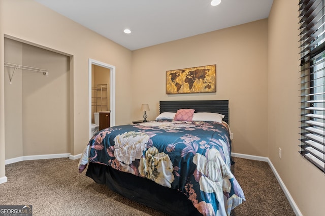 carpeted bedroom with recessed lighting, ensuite bath, and baseboards