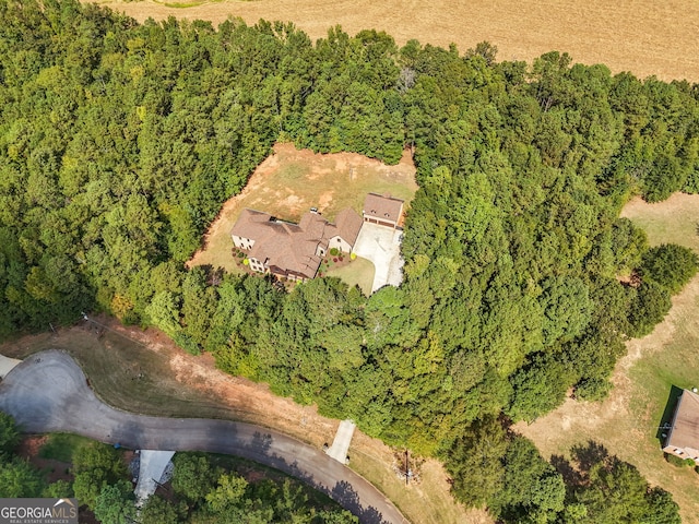 bird's eye view featuring a forest view