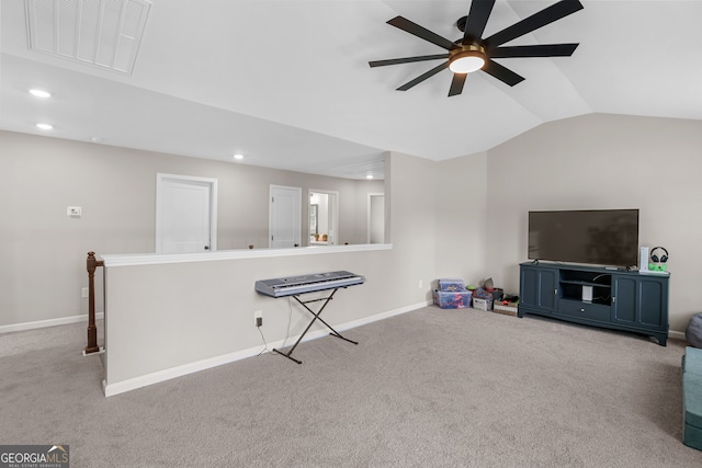 living room featuring vaulted ceiling, ceiling fan, and light colored carpet