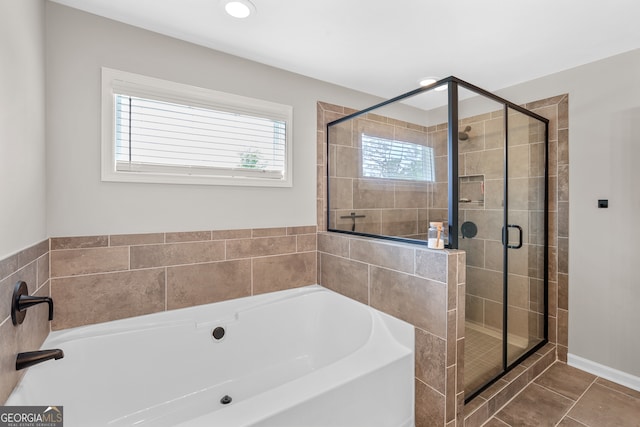 bathroom featuring independent shower and bath and tile patterned floors