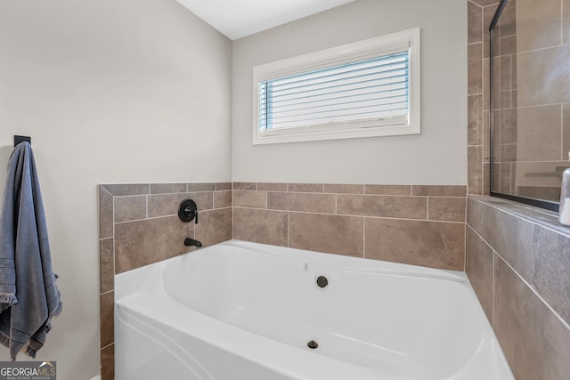 bathroom featuring a washtub