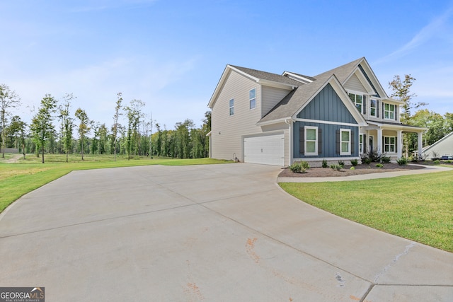 view of front facade featuring a front yard and a garage