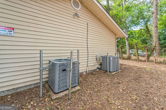 view of side of property featuring central air condition unit