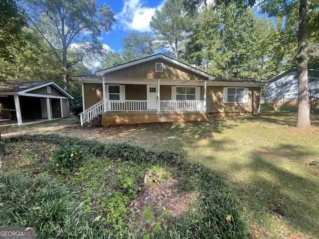 view of front of house featuring covered porch and a front yard