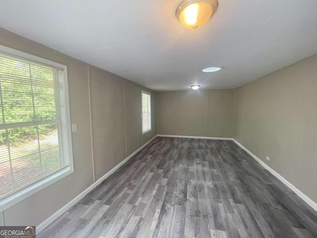 empty room featuring dark wood-type flooring