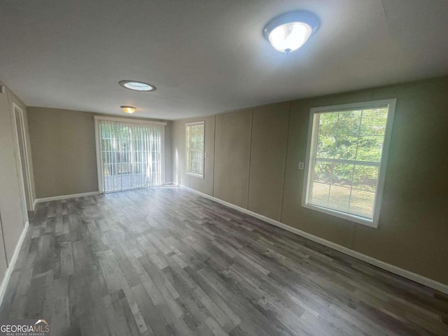 spare room featuring dark hardwood / wood-style floors