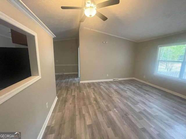 unfurnished room featuring ornamental molding, ceiling fan, hardwood / wood-style floors, and a textured ceiling