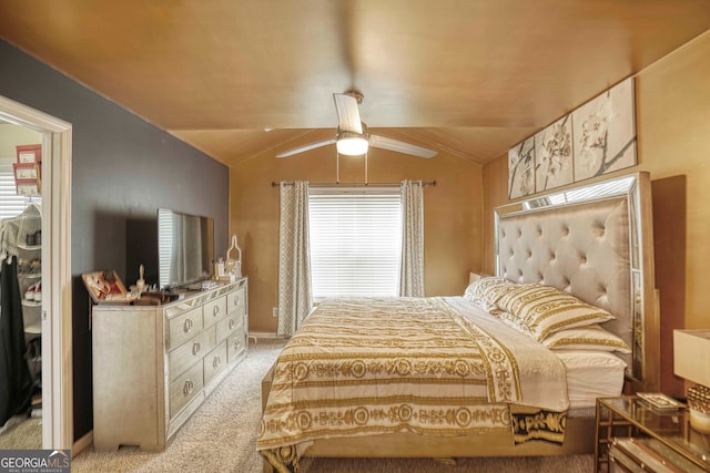 bedroom featuring ceiling fan, light carpet, and vaulted ceiling