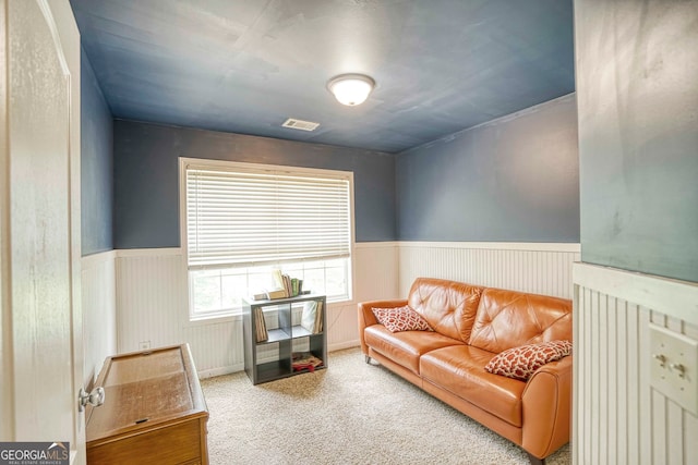 living area featuring carpet floors