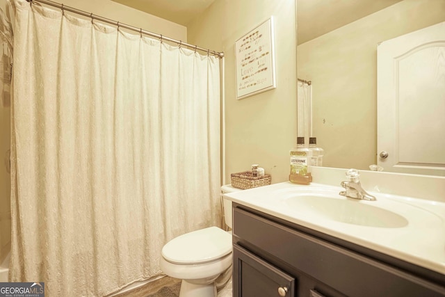 bathroom featuring vanity, hardwood / wood-style floors, toilet, and curtained shower