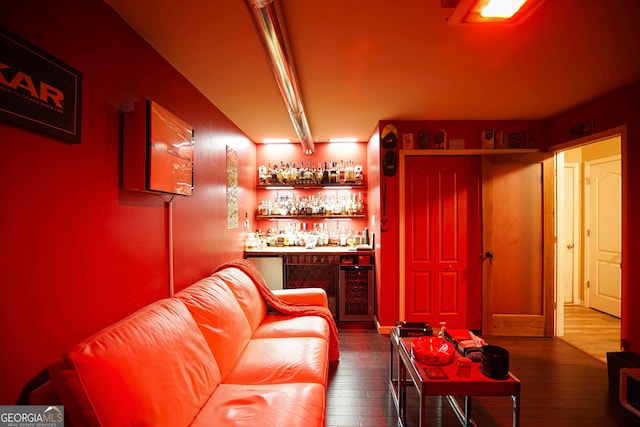 bar with wine cooler and hardwood / wood-style flooring